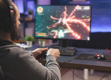 A man playing a game on a PC